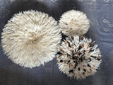 white and brown juju hats