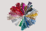 Colorful tassel arrangement on a light gray background
