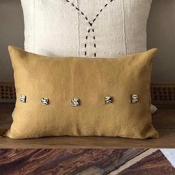 Saffron Yellow Linen Cushion with African Sourced Buttons. The Os de Chameau Cushion.