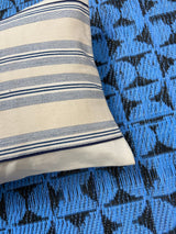 stripe cushion on blue mat