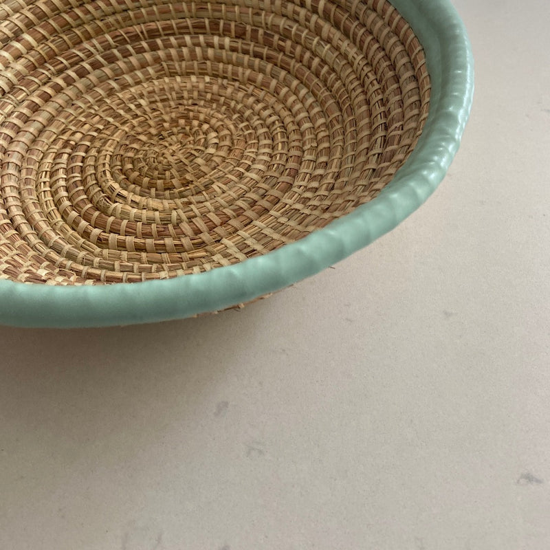 handwoven bowl with light blue leather trim