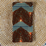 Rectangular fabric with geometric pattern on a woven mat