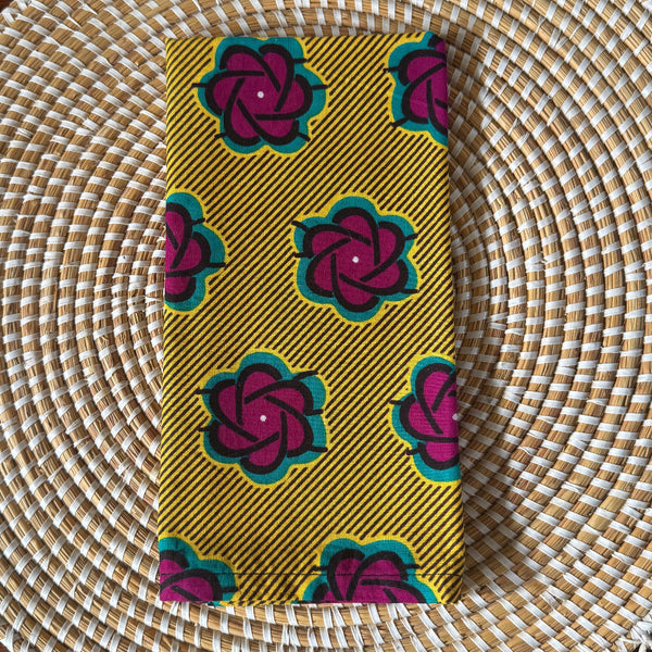 Phone case with floral pattern on a woven surface