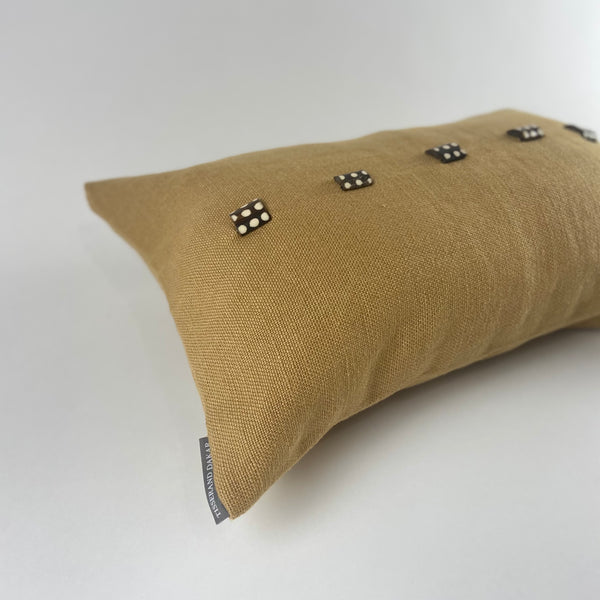 Saffron Yellow Linen Cushion with African Sourced Buttons. The Os de Chameau Cushion.