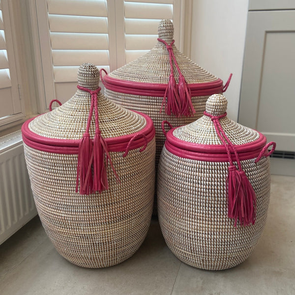 White baskets with pink trim 