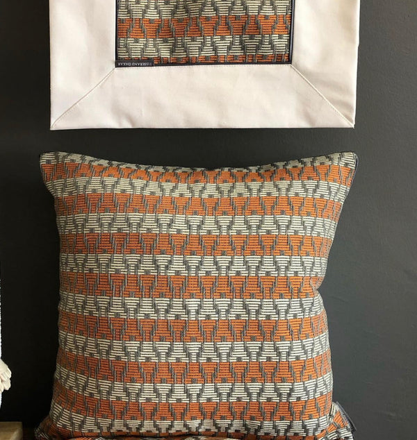 Orange, Grey and White Handwoven Pagne Tissé Cushion. The Fleur D’Oranger Cushion.