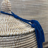 White basket with blue tassel