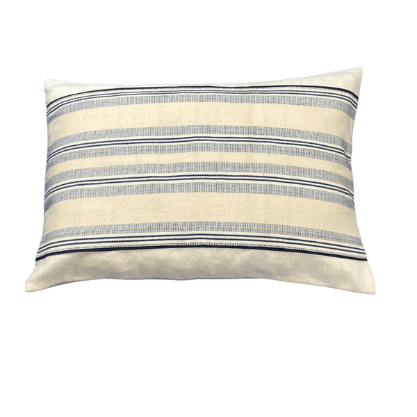 Striped pillow with blue and beige pattern on a white background
